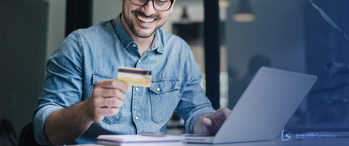 A businessman paying something online